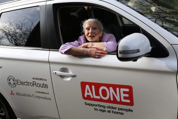 Repro Free: 22nd March 2017. ALONE, the charity that supports older people to age at home, today received a donation of a Mitsubishi Outlander PHEV (Plug-in Hybrid Electric Vehicle) from ElectroRoute, the leading Irish energy trading and services firm, and Mitsubishi Corporation, the global, integrated business enterprise headquartered in Japan. The car will be used by ALONE to provide its befriending, support, advocacy and housing services to older people throughout Ireland. Margaret Dougan, who avails of ALONEs services, is pictured in the new car. Picture Jason Clarke